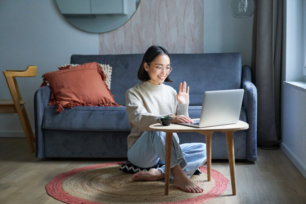 Young girl on computer looking up affordable in-person therapy and counselling services online